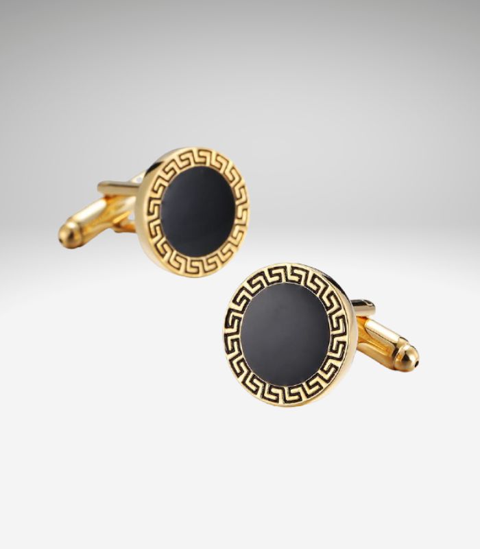 Guldfavede manchetknapper med sort mønster