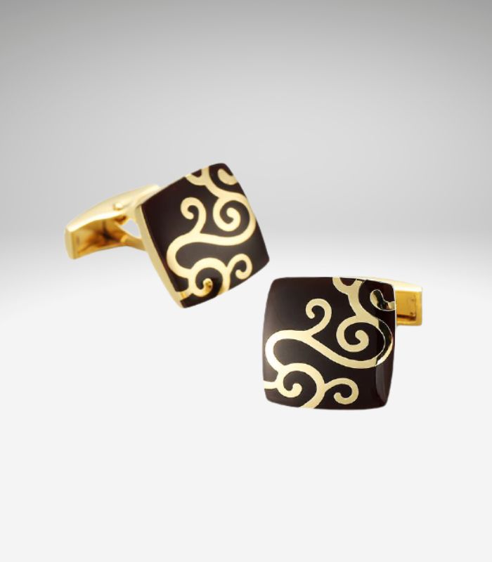 Guldfarvede sorte manchetknapper